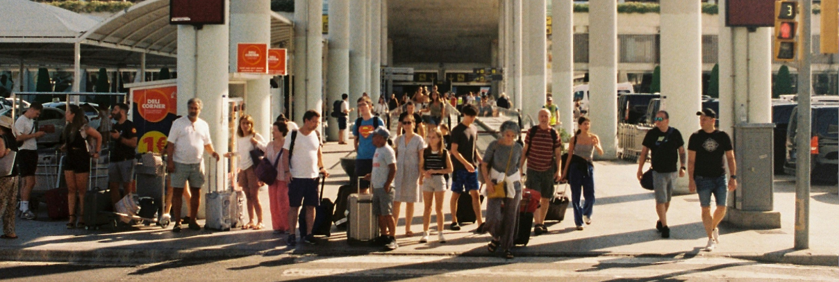 Photograph of ferry terminal busy with crowds of people entering and leaving the building to illustrate how pedestrian counts using LiDAR systems can improve the efficiency of transport hubs.